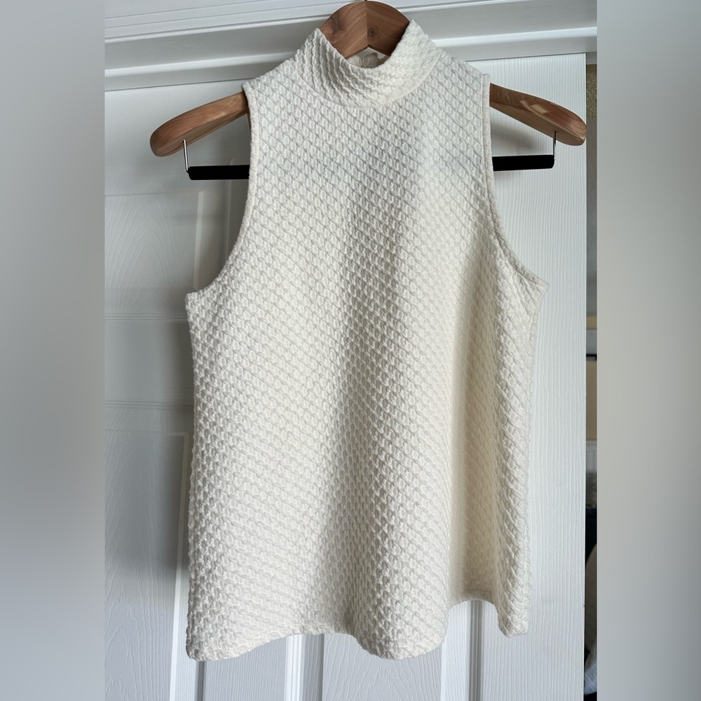 Off white sleeveless mock turtleneck tank. Used